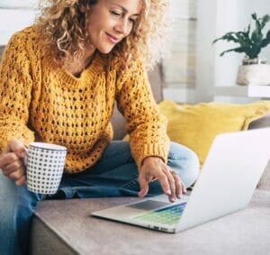 Woman Using Shamrock's Custom Label Maker on laptop